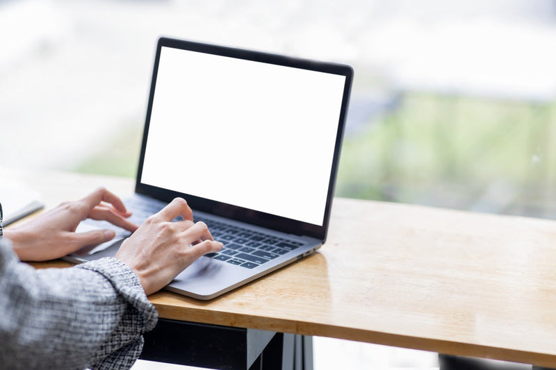 JC Chem tuition student using a laptop to study